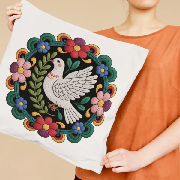 Home 69 Woman holding a square pillow printed with bohemian dove embroidery art featuring colorful flowers and a peace bird mandala, ideal for home decor and POD products.