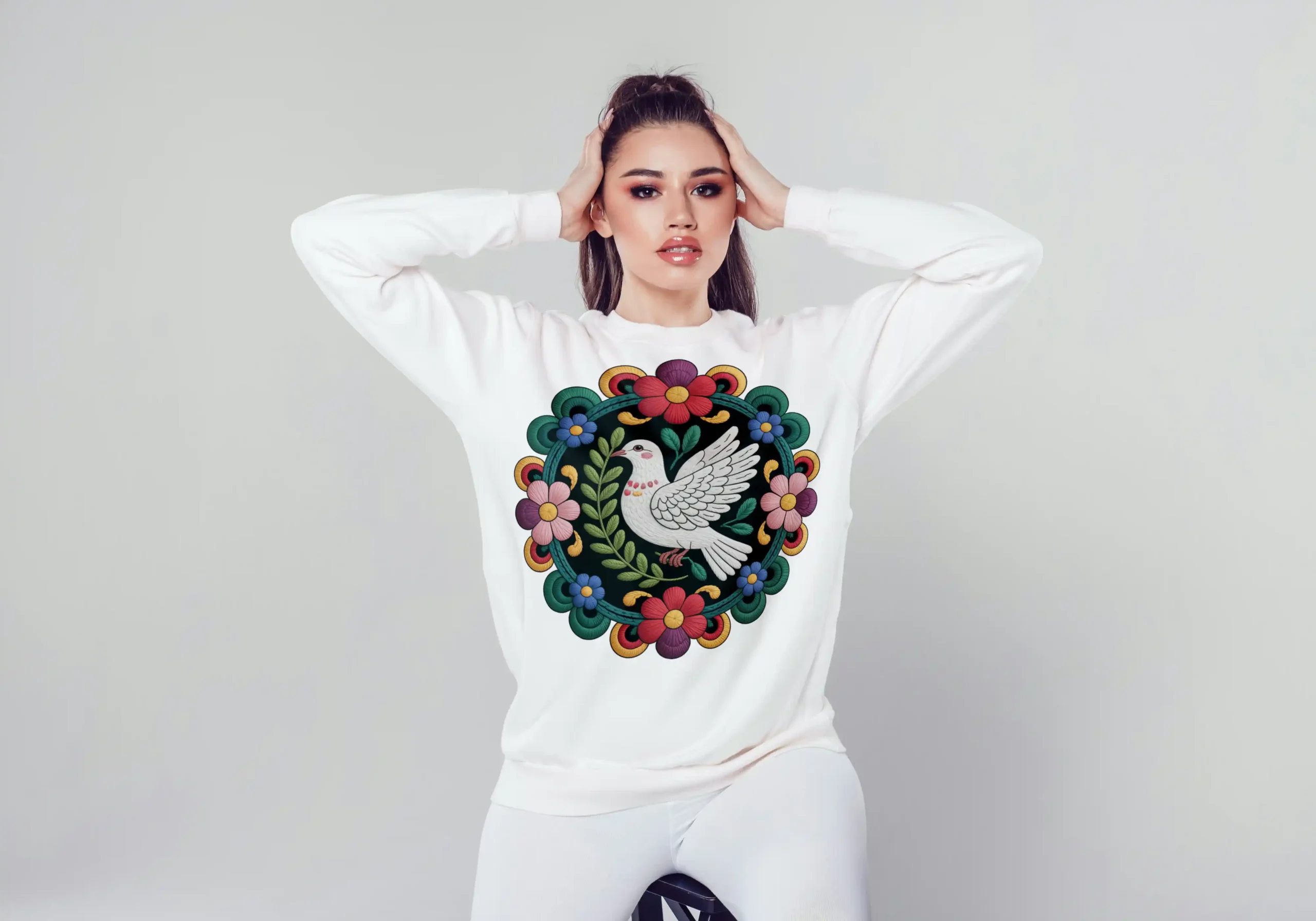 Bohemian Dove Embroidery Art - Peace Bird Floral Mandala 3 Model wearing a white sweatshirt featuring a bohemian dove embroidery art design with colorful floral mandala pattern, showcasing the printable peace bird artwork for apparel.